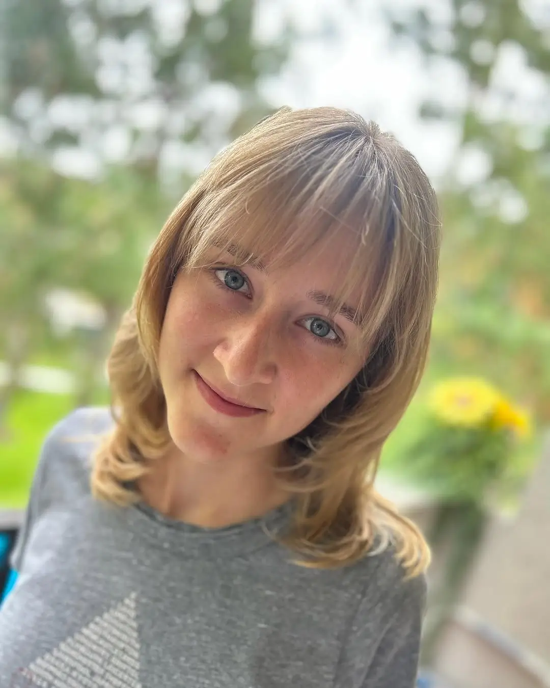 summer haircuts for girls 2026 Soft Layered Bob With Airy Bangs