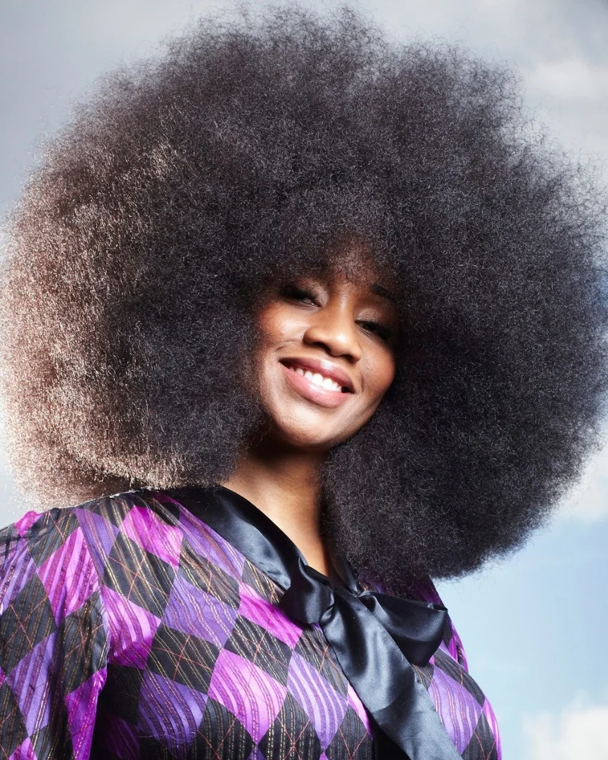 summer hairstyles for black women 2026 Full Natural Afro with Bold Volume