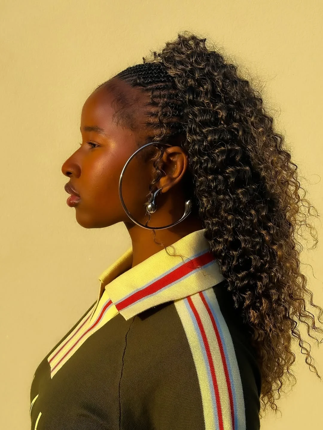 summer hairstyles for black women 2026 Sculpted Braids into a Curly Power Pony