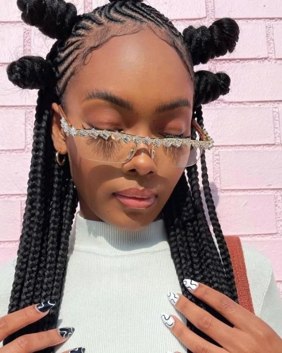 summer hairstyles for black women 2026 Playful Space Buns with Braided Precision