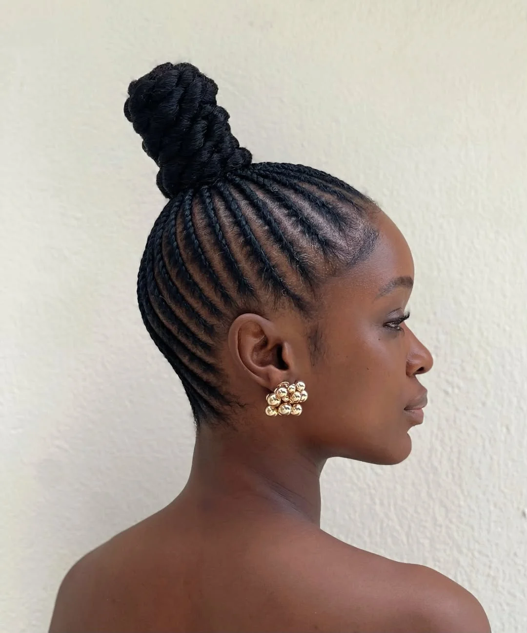 summer hairstyles for black women 2026 Sculpted Braided Bun with Elegant Lines