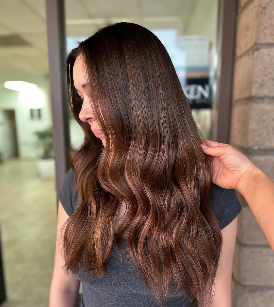 summer money piece hair color for women 2026 Soft Chocolate Waves with a Melted Front Glow
