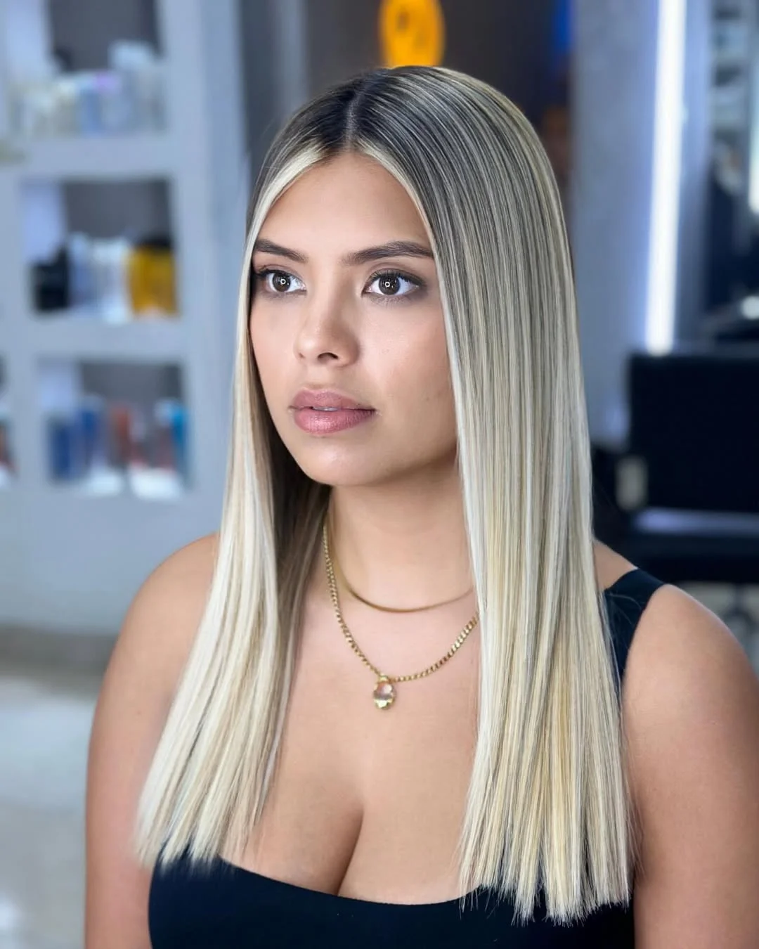 summer money piece hair color for women 2026 Bold Platinum Frame on Sleek Straight Lengths