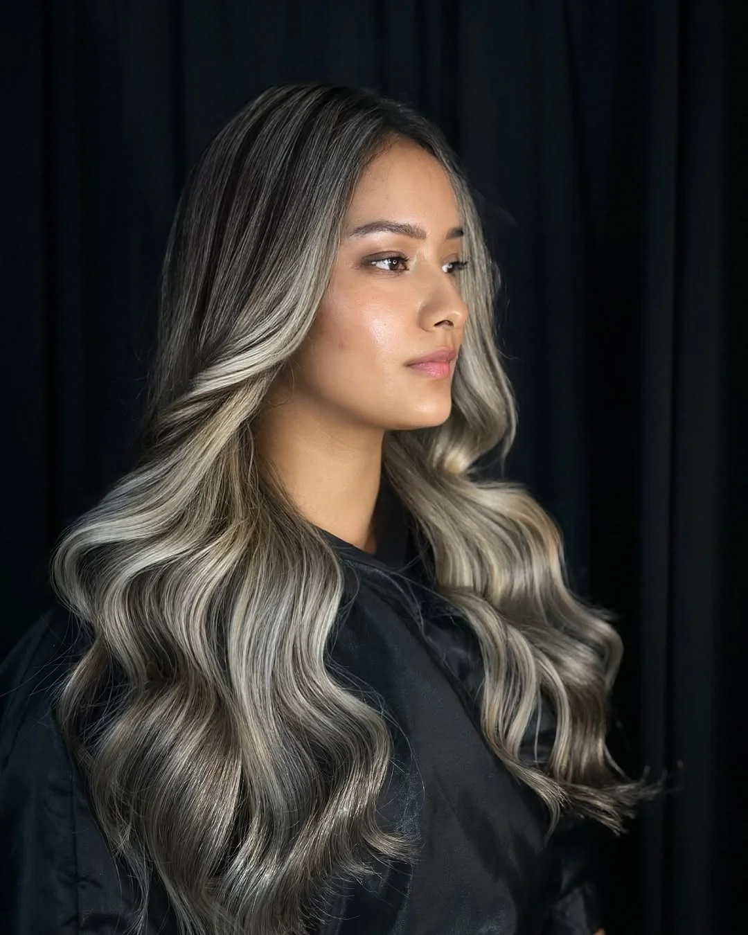 summer money piece hair color for women 2026 Smoky Cool Brunette with Soft Front Contrast