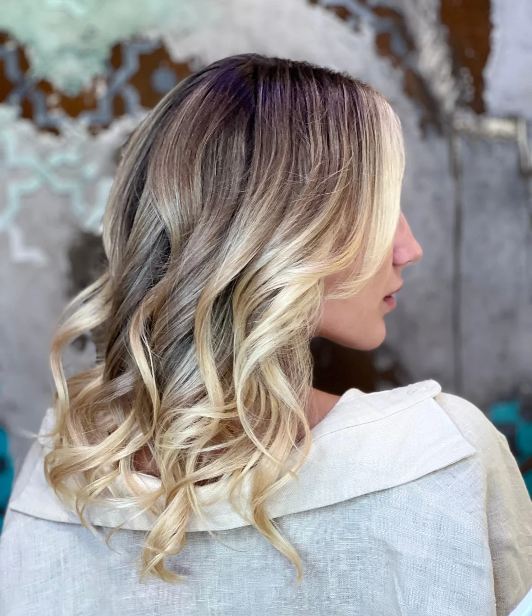 summer money piece hair color for women 2026 Soft Blonde Ombre with Curly Dimension