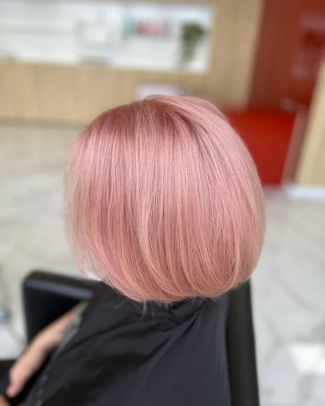 summer strawberry blonde hair color for women 2026 Polished Rose Gold Bob with a Perfect Rounded Shape