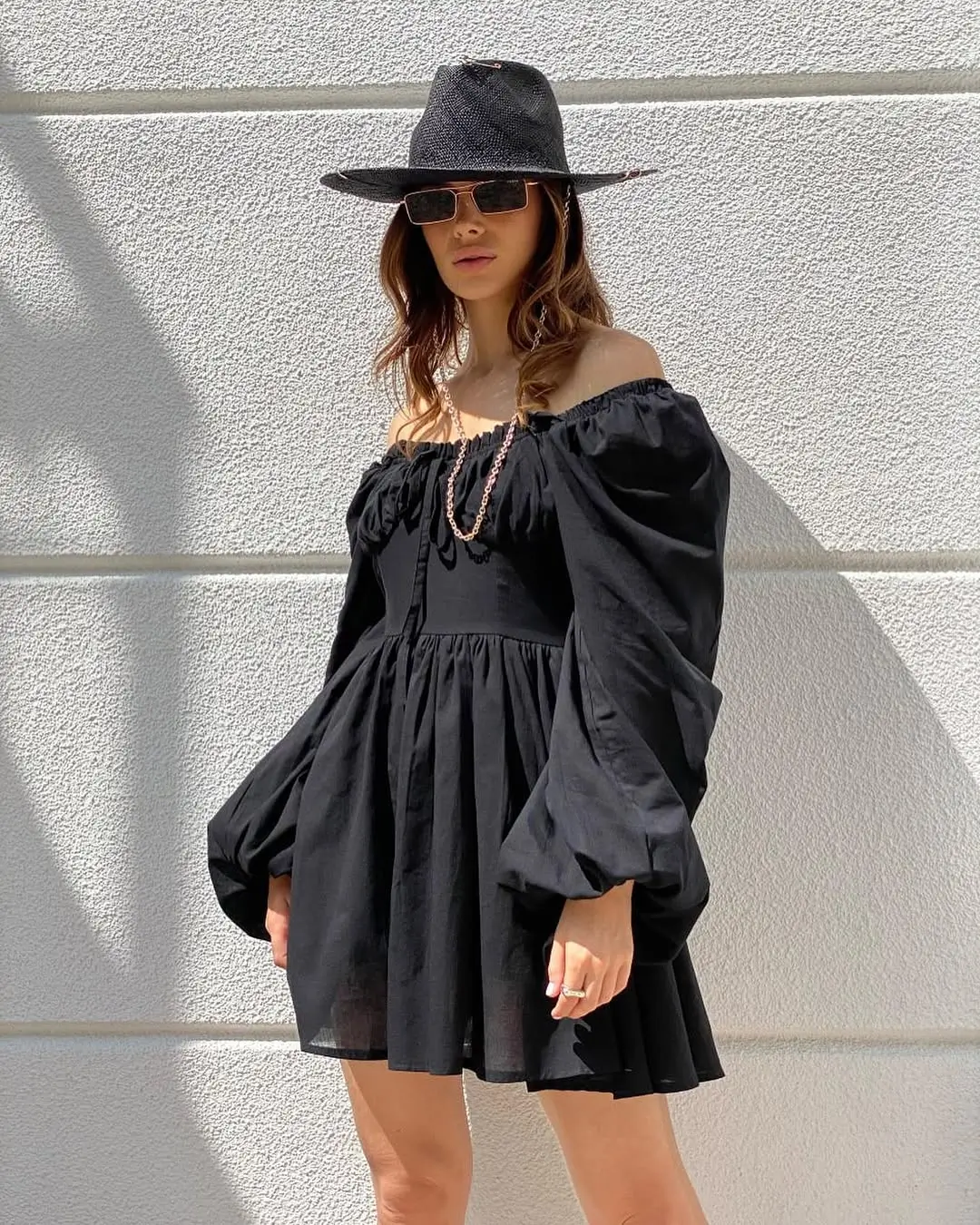 summer vacation outfits 2026 Black Mini Dress with Statement Sleeves and Modern Edge