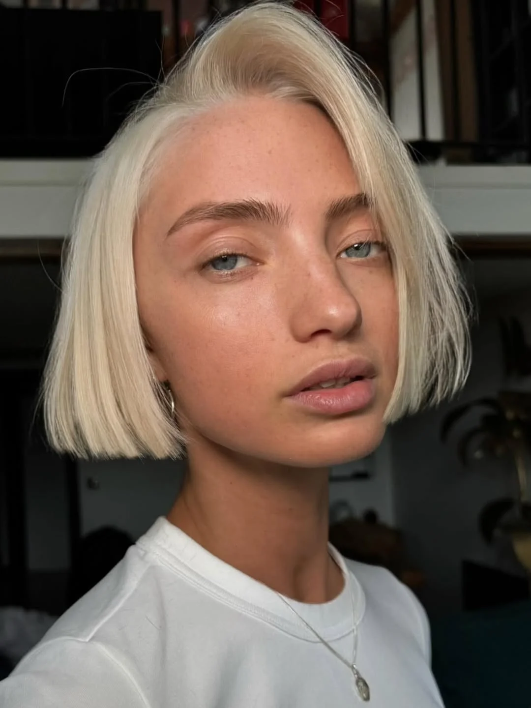 textured summer bob haircut 2026 Clean Platinum Precision Bob with Minimal Layers