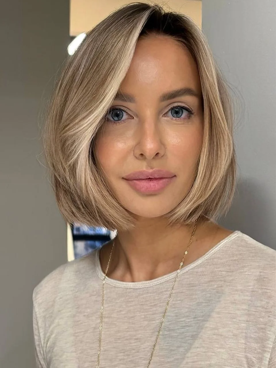 textured summer bob haircut 2026 Angled Soft Blonde Bob with Natural Volume