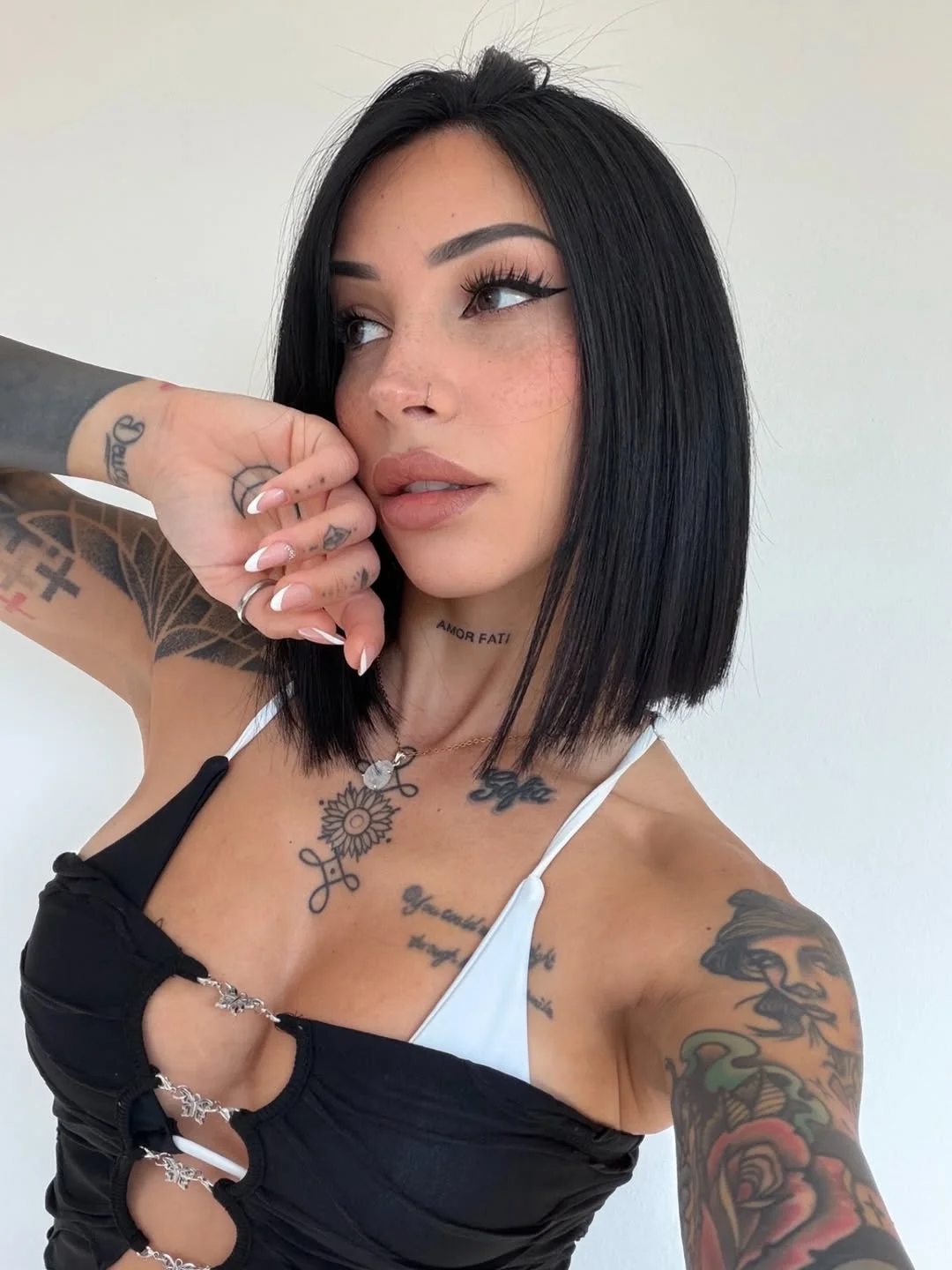 textured summer bob haircut 2026 Sleek jet black angled bob with sharp finish