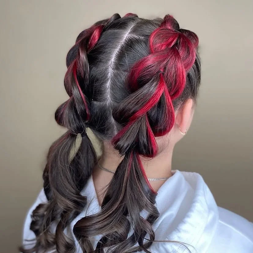 boho summer braids hairstyle 2026 Bold red threaded braids with playful structure