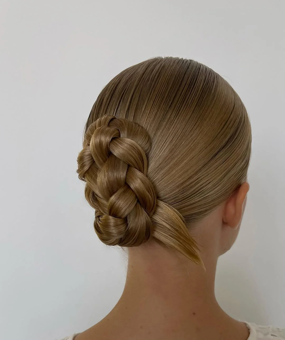 boho summer braids hairstyle 2026 Side braided low bun with soft elegance
