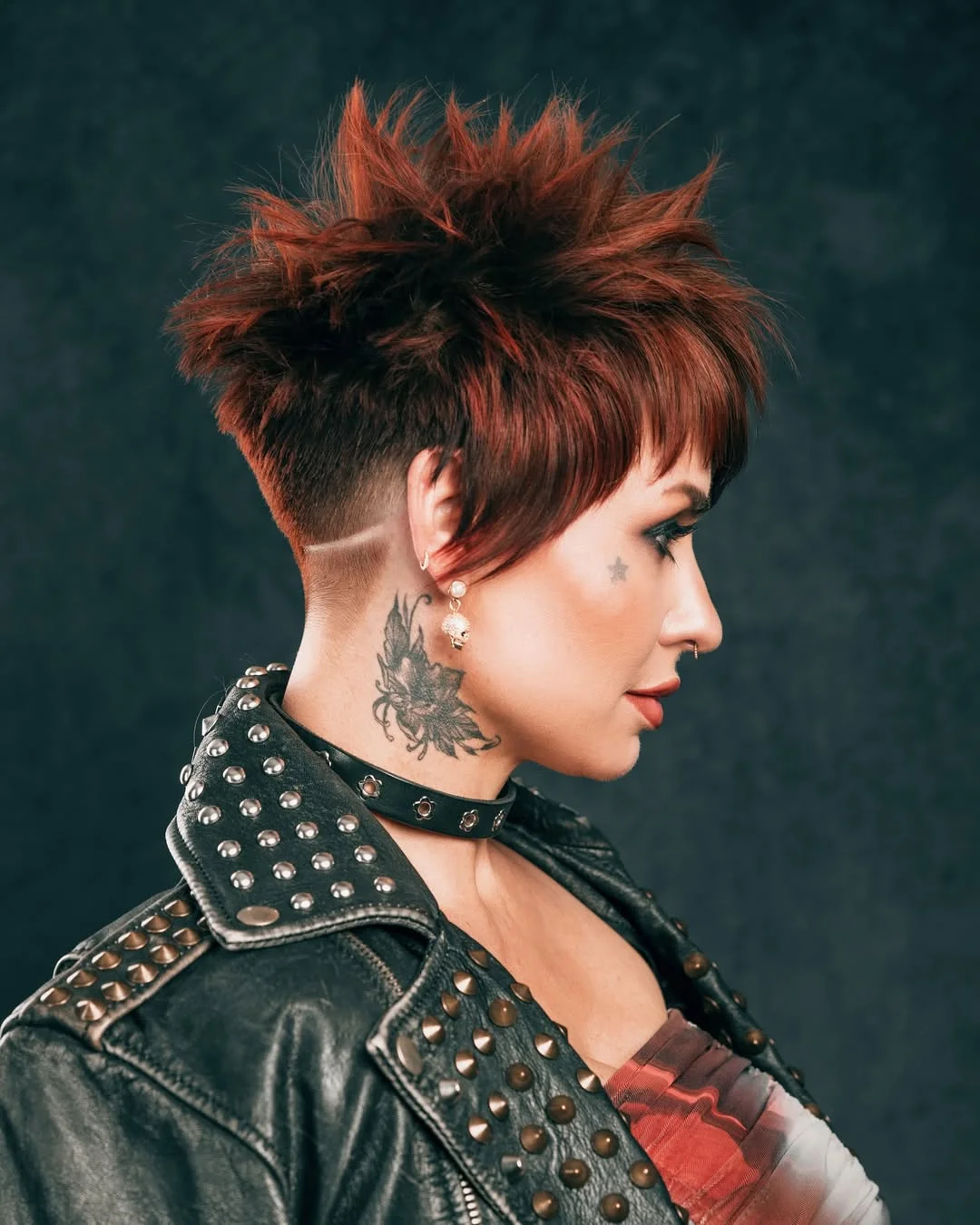 bold summer pixie haircuts 2026 Undercut Spiky Pixie with Deep Red Dimension