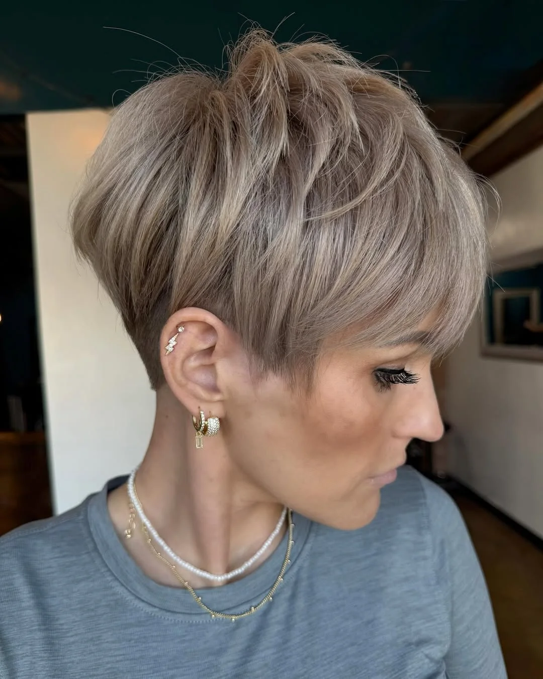 bold summer pixie haircuts 2026 Feathered Volume Pixie with Side Sweep