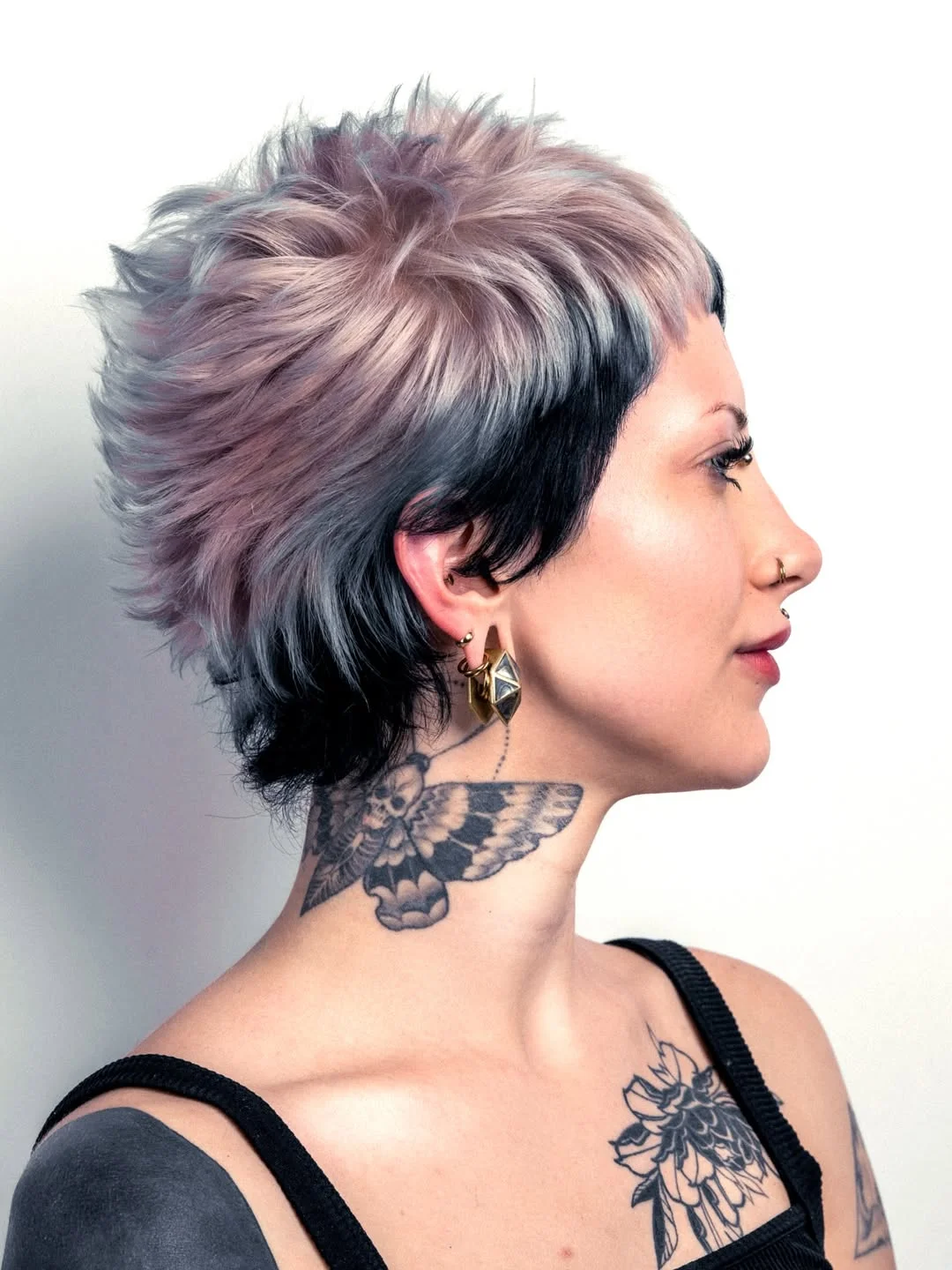 bold summer pixie haircuts 2026 Feathered Rebel Pixie with Smoky Dimension