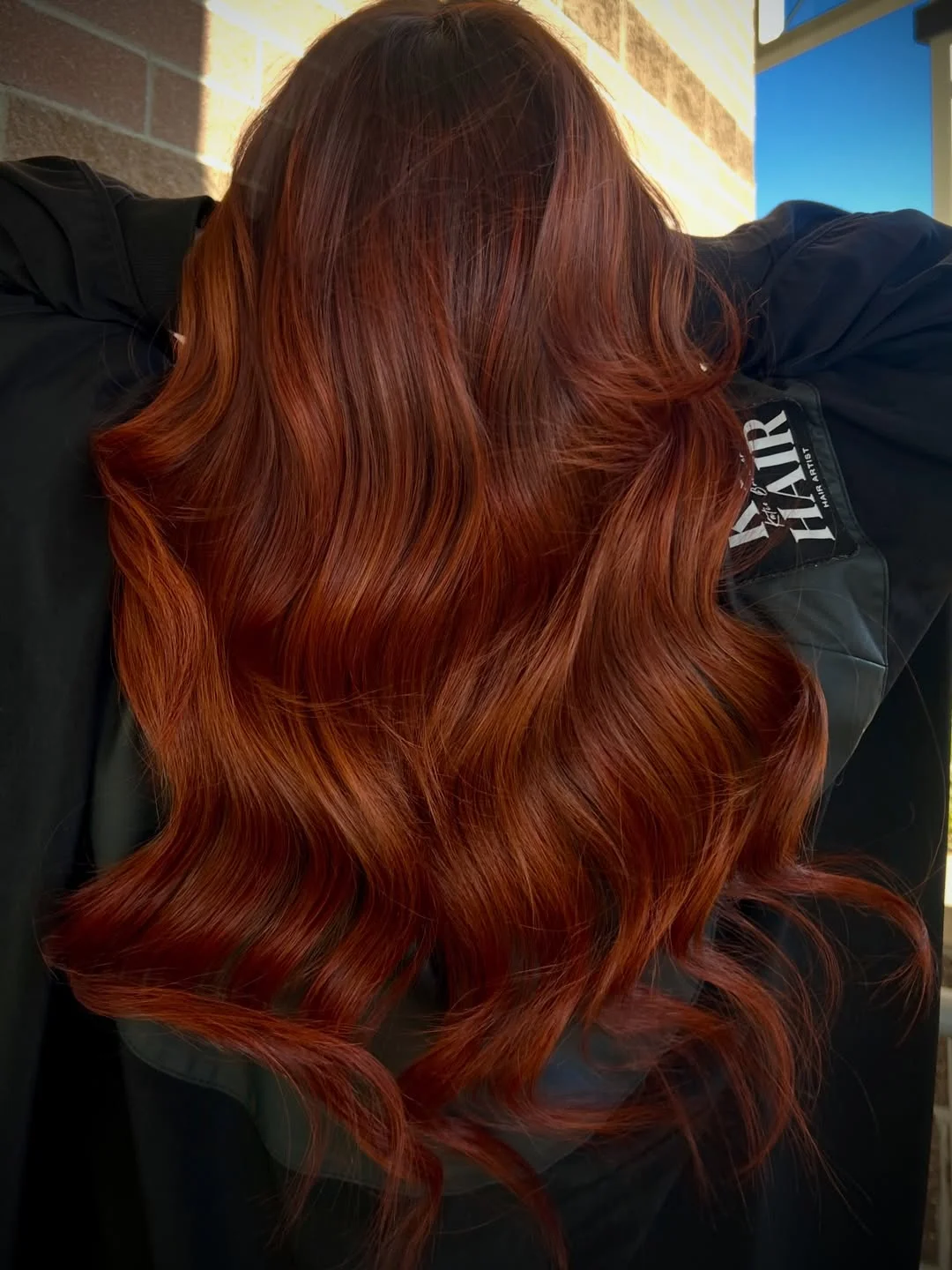 chic summer auburn hair color 2026 Rich Cinnamon Auburn With Glossy Waves