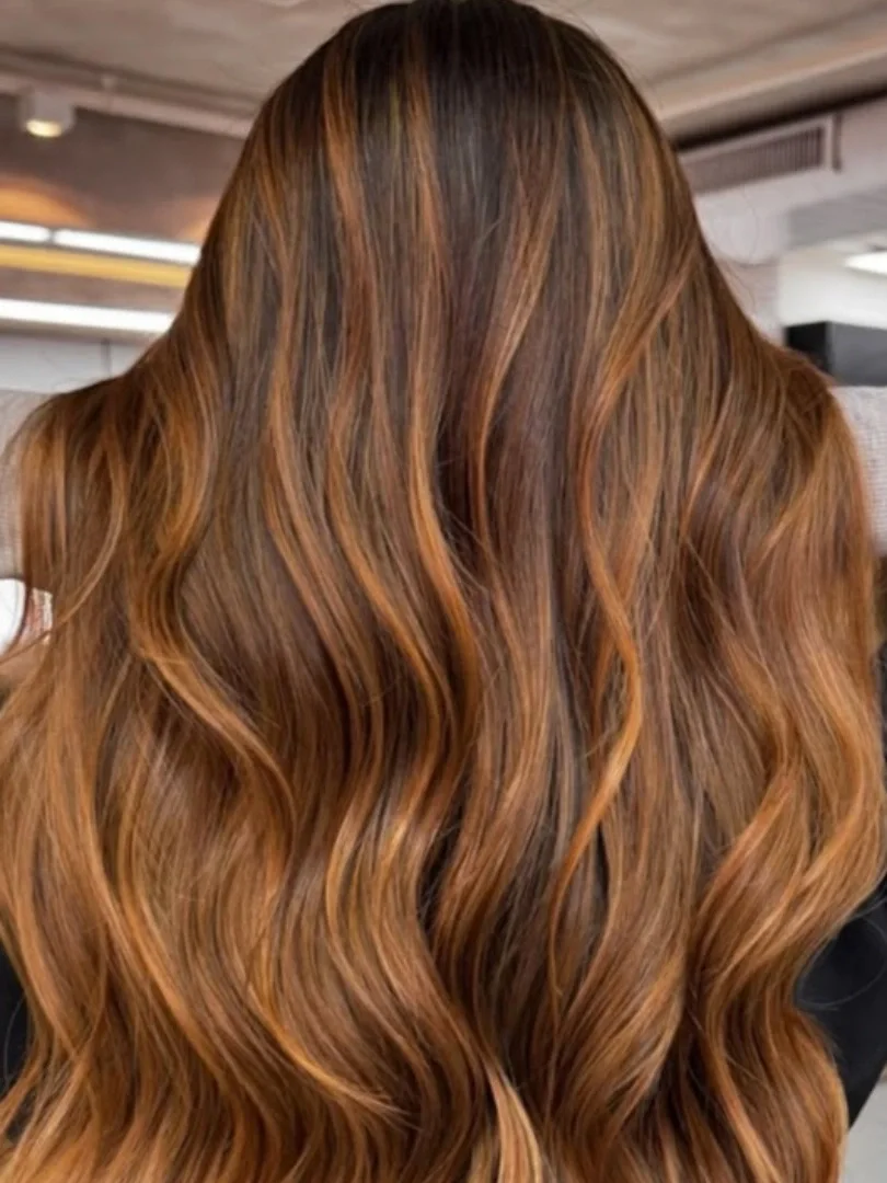 chic summer auburn hair color 2026 Soft Copper Balayage On Dark Brown Hair