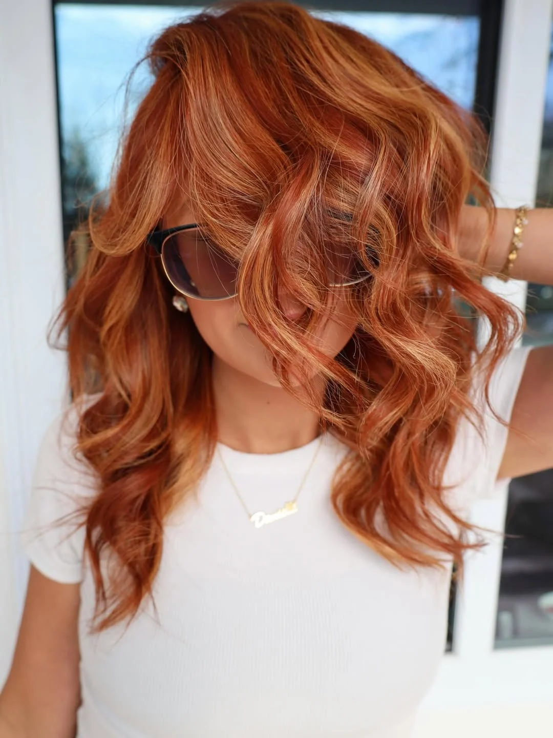 chic summer auburn hair color 2026 Golden Auburn Curls With Blonde Dimension