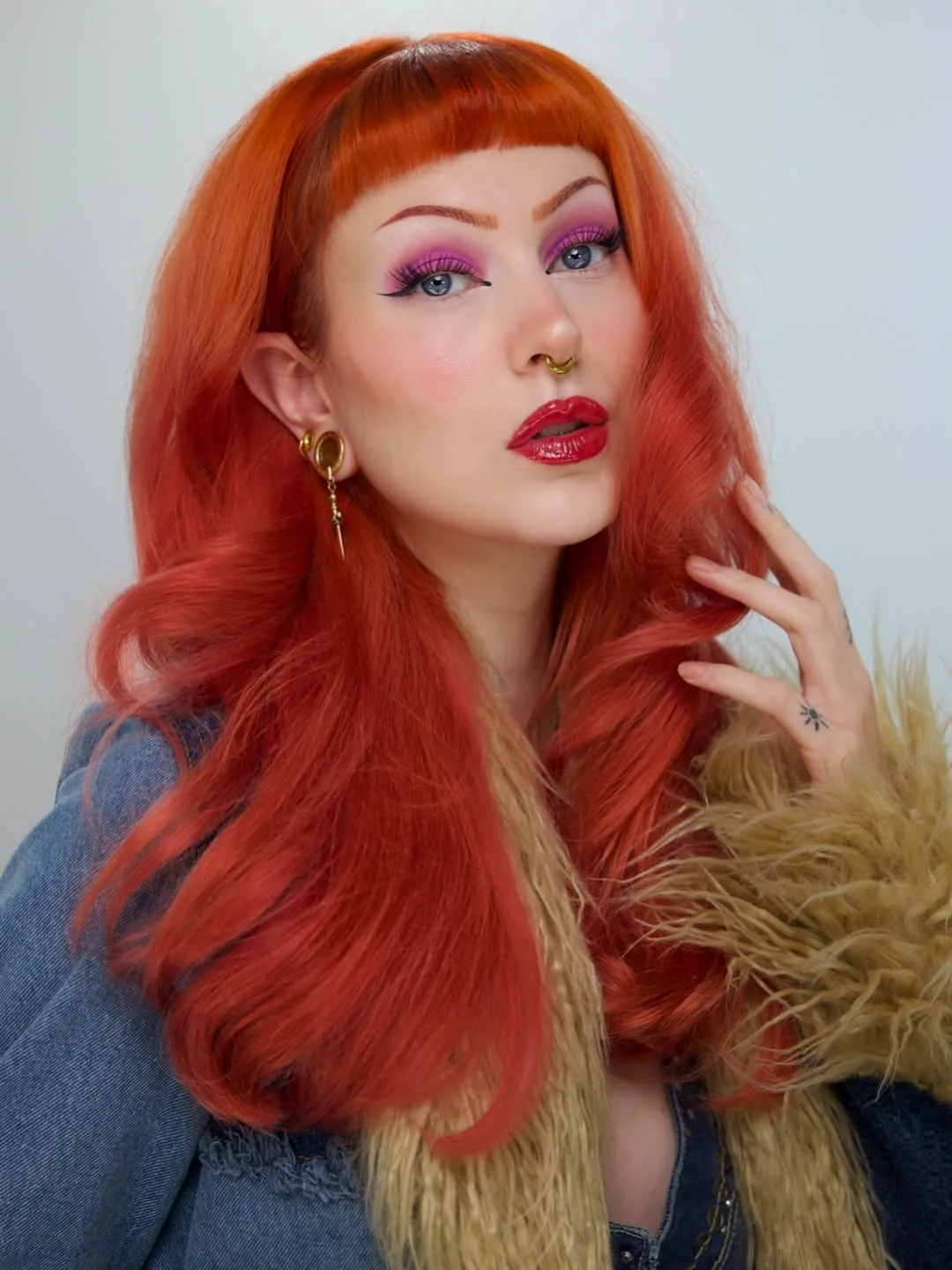 chic summer auburn hair color 2026 Vibrant Retro Copper Auburn With Baby Bangs
