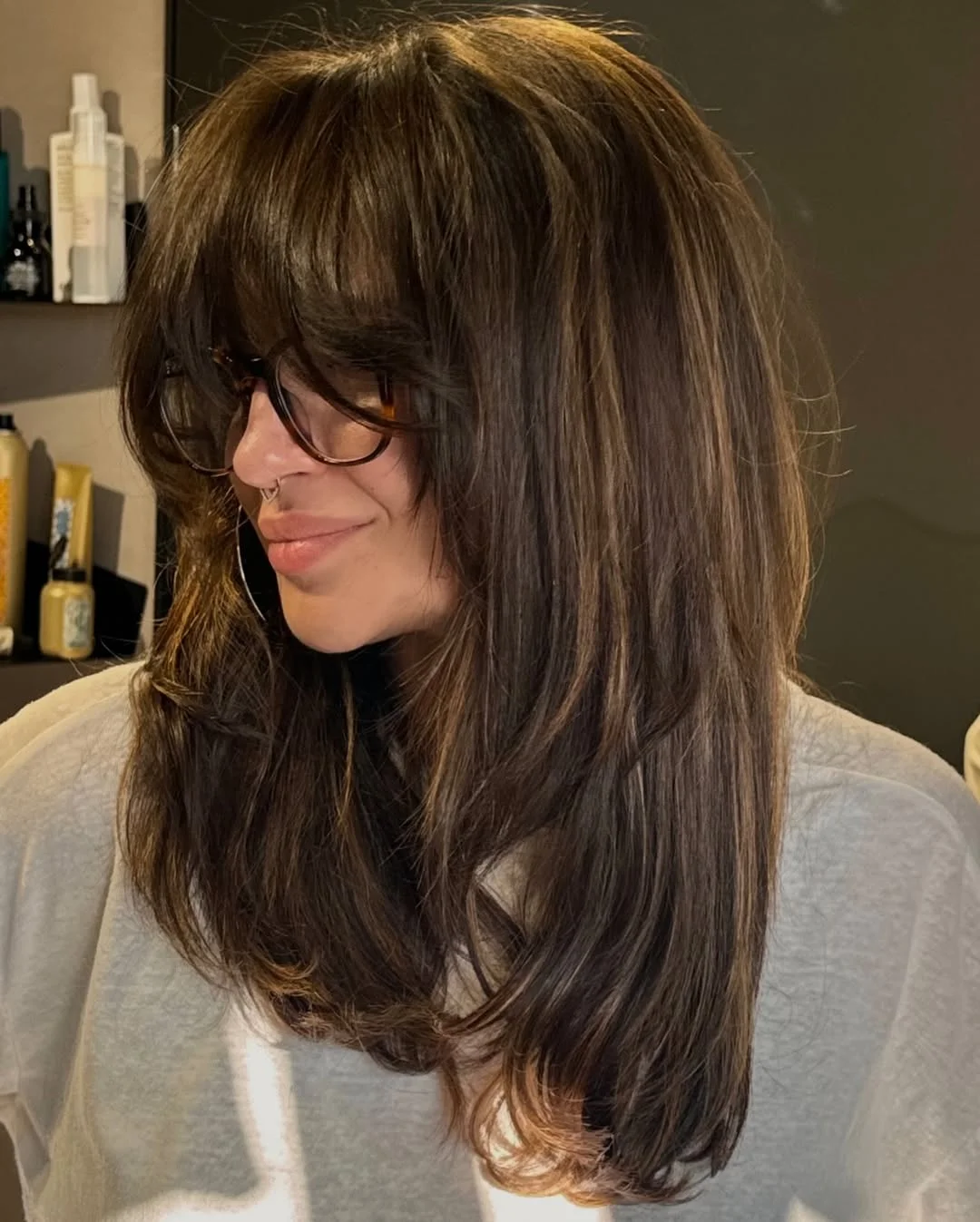 chic summer haircuts for women over 40 2026 Soft Butterfly Layers with Effortless Bangs