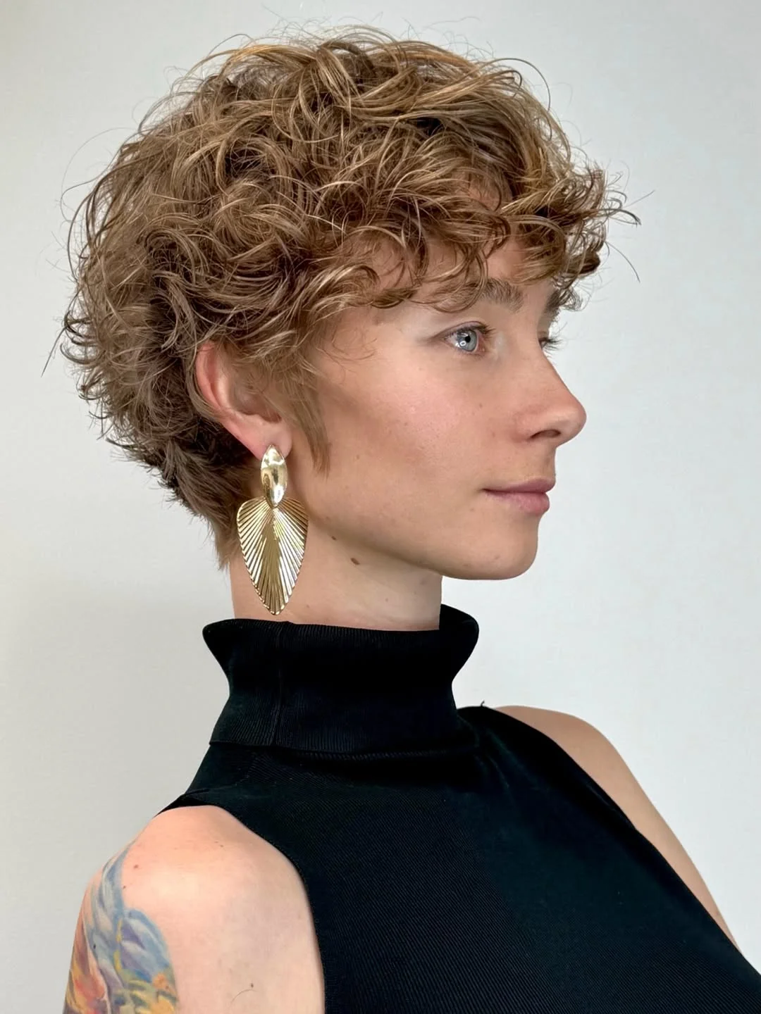 chic summer haircuts for women over 40 2026 Curly Layered Short with Playful Volume