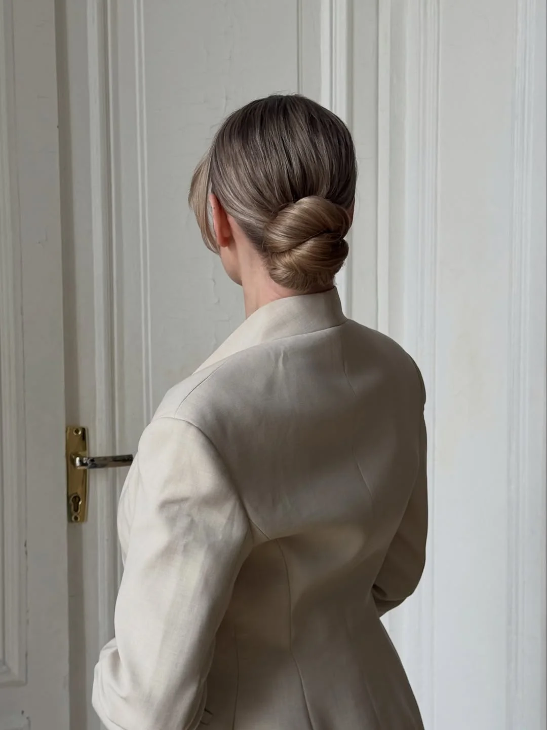effortless summer quick hairstyles 2026 Twisted Low Chignon With Understated Elegance