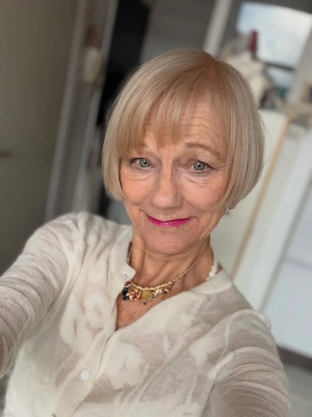 elegant summer haircuts for women over 60 2026 Classic Short Bob with Light Bangs