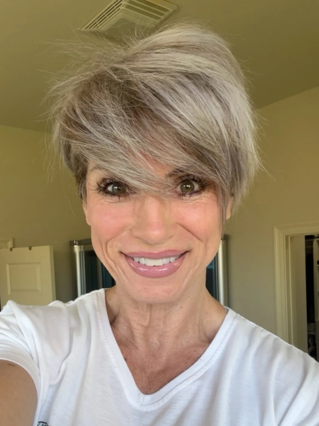 elegant summer haircuts for women over 60 2026 Short Sassy Pixie with Volume and Side-Swept Bangs