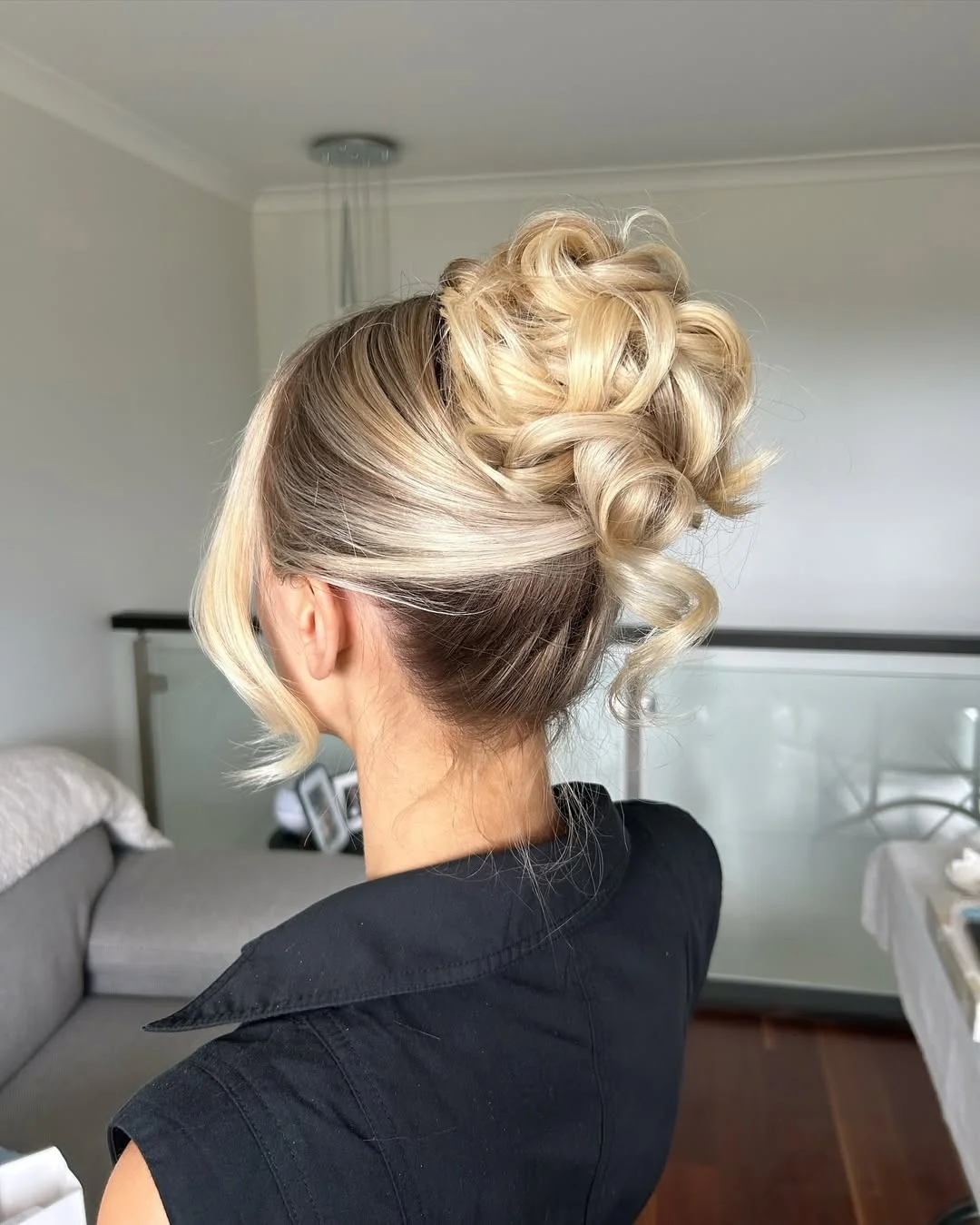 elegant summer updo hairstyles 2026 Soft Twisted Blonde Bun with Airy Face Framing