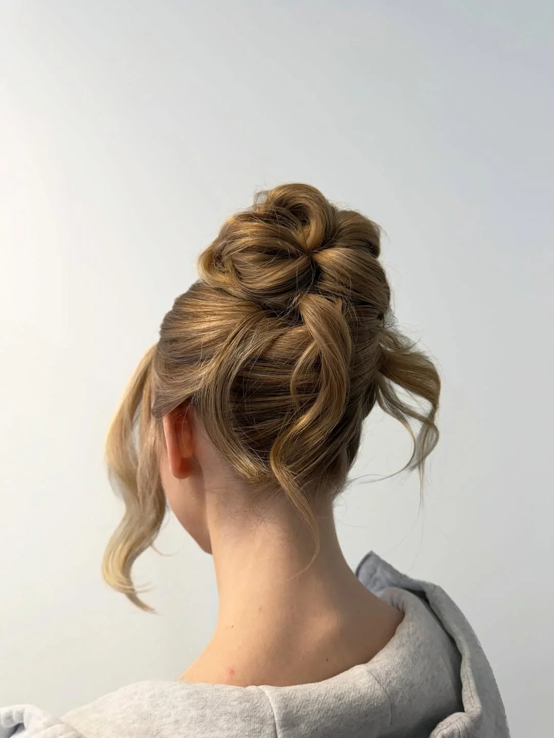 elegant summer updo hairstyles 2026 Relaxed Golden Updo with Loose Romantic Pieces