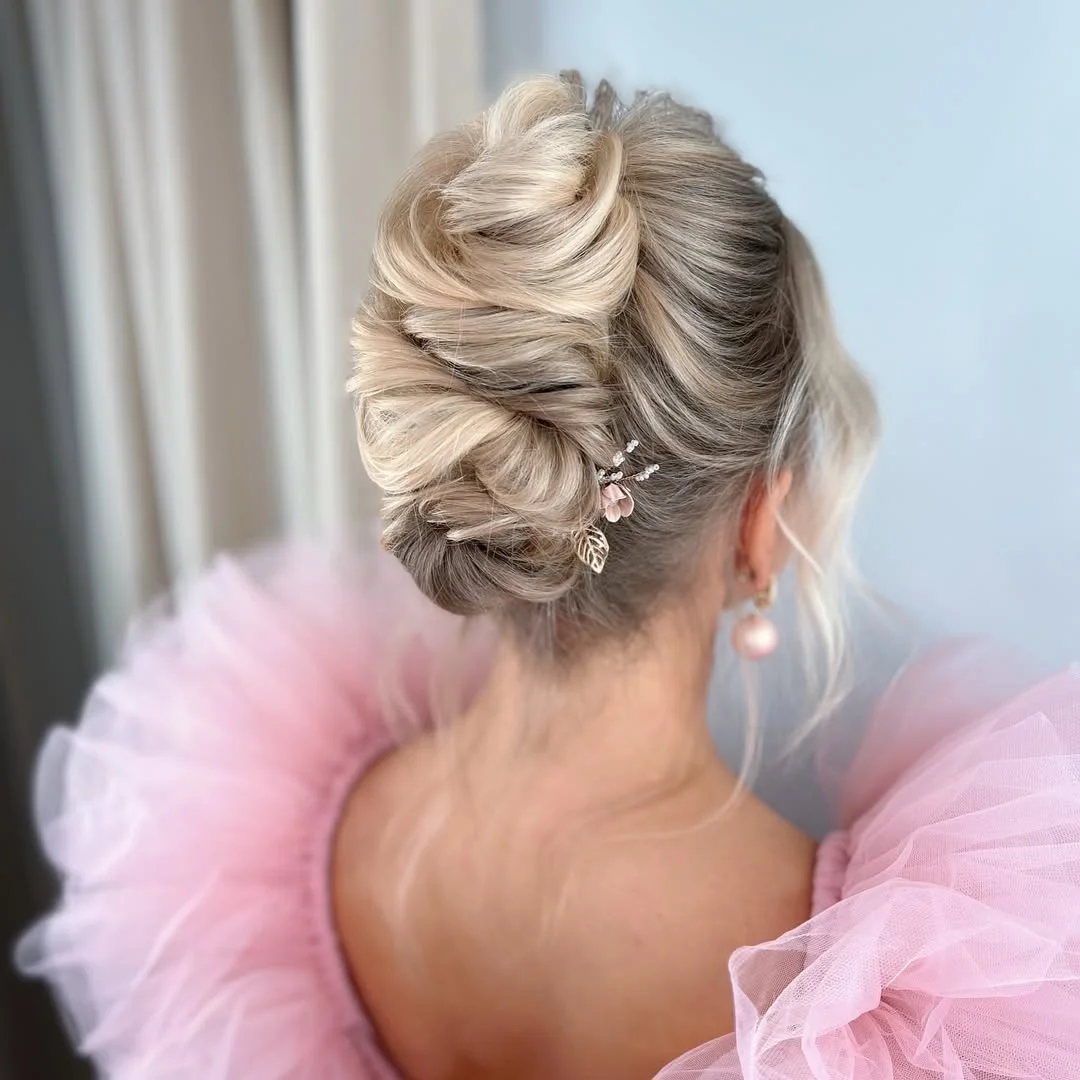 elegant summer updo hairstyles 2026 Textured Blonde Updo with Delicate Hairpiece