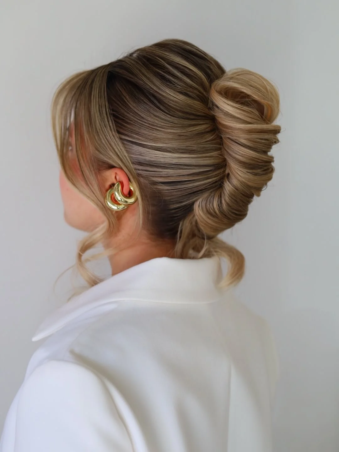 elegant summer updo hairstyles 2026 Voluminous Twisted Bun with Soft Dimension
