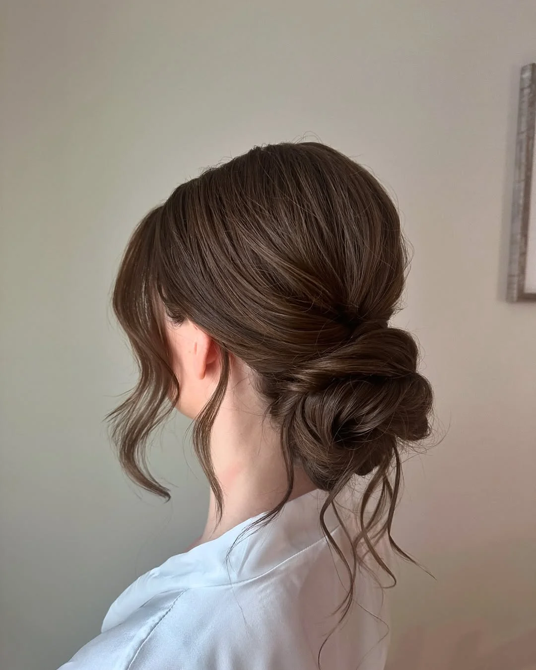 elegant summer updo hairstyles 2026 Low Textured Bun with Effortless Strands