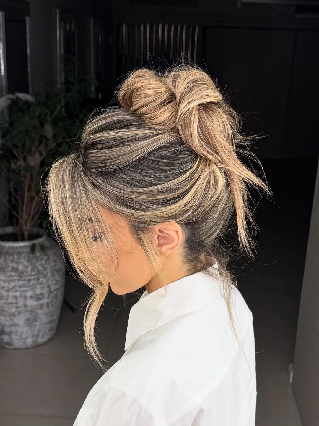 elegant summer updo hairstyles 2026 Playful High Bun with Face Framing Layers