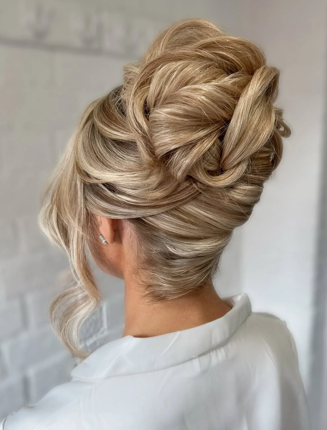 elegant summer updo hairstyles 2026 Voluminous Blonde Updo with Soft Structure