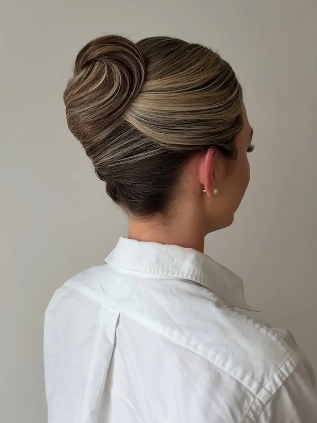 elegant summer updo hairstyles 2026 Classic Twisted Bun with Smooth Layers