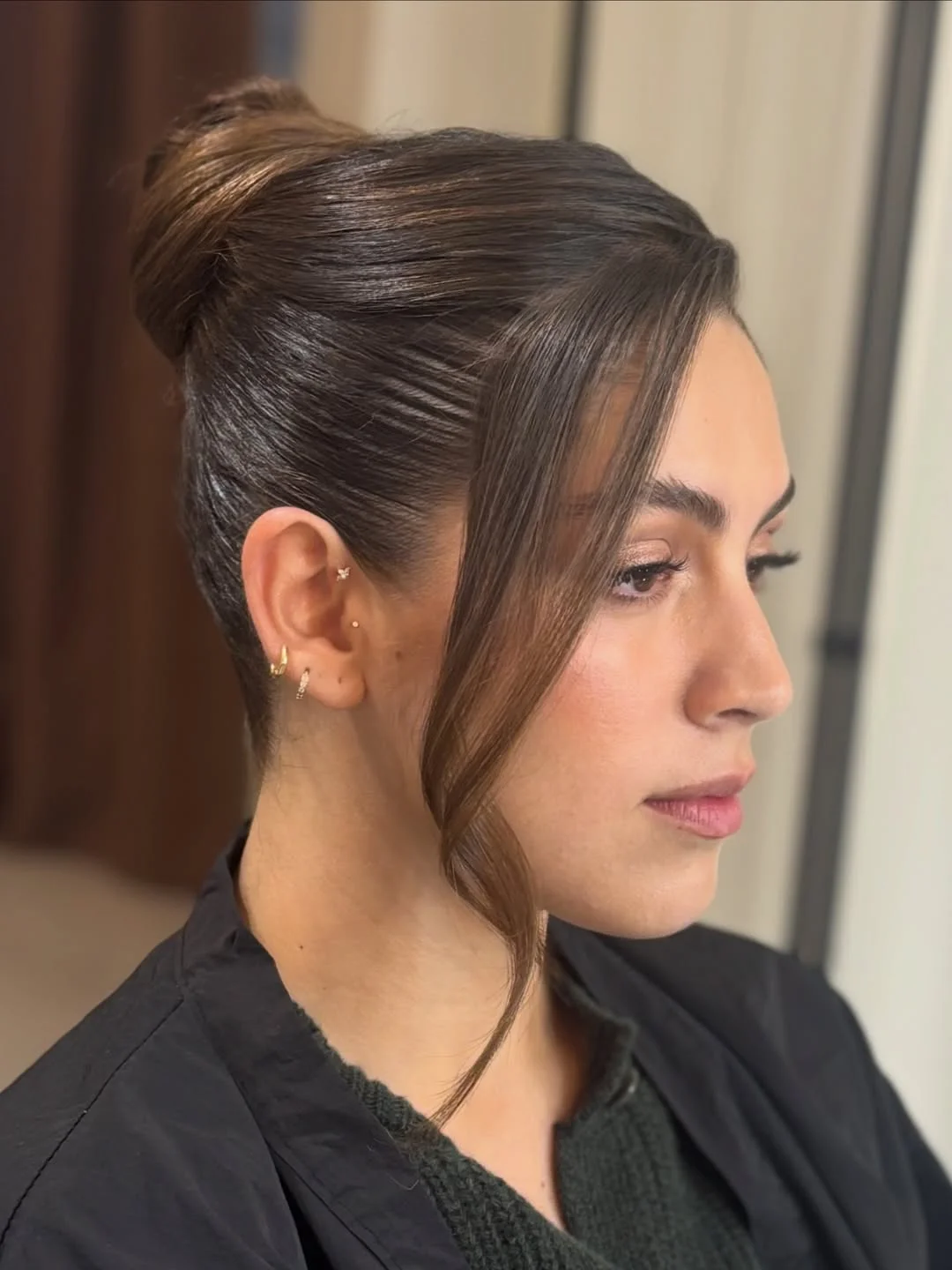 elegant summer updo hairstyles 2026 High Sleek Bun with Face Framing Detail