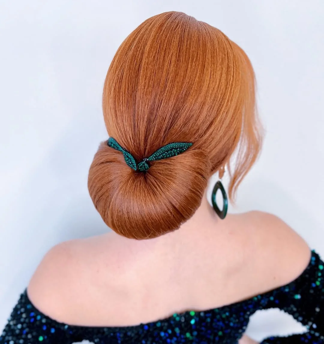 elegant summer updo hairstyles 2026 Sleek Low Bun with Statement Accessory