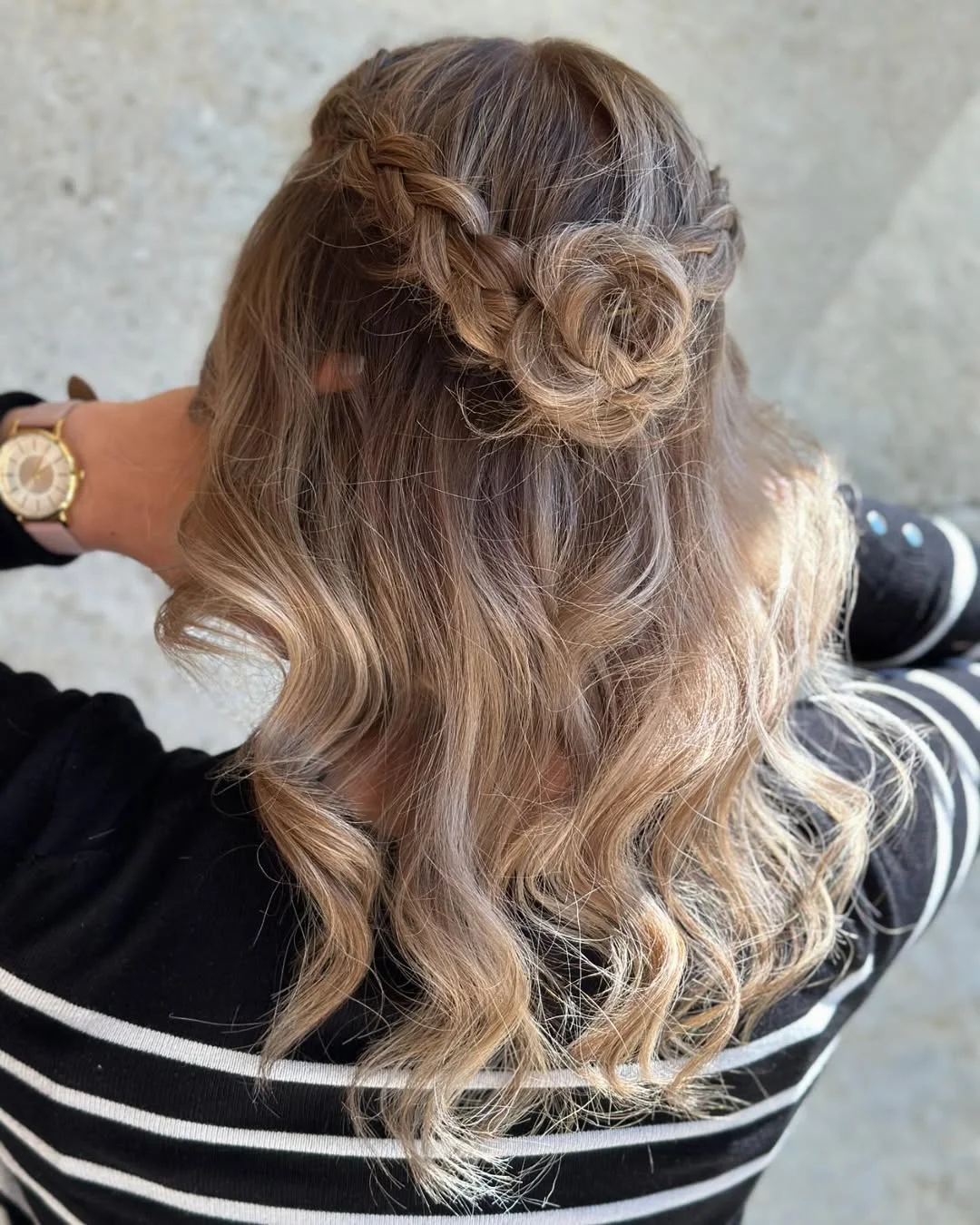 elegant summer wedding guest hairstyles 2026 Loose Braided Rose Detail