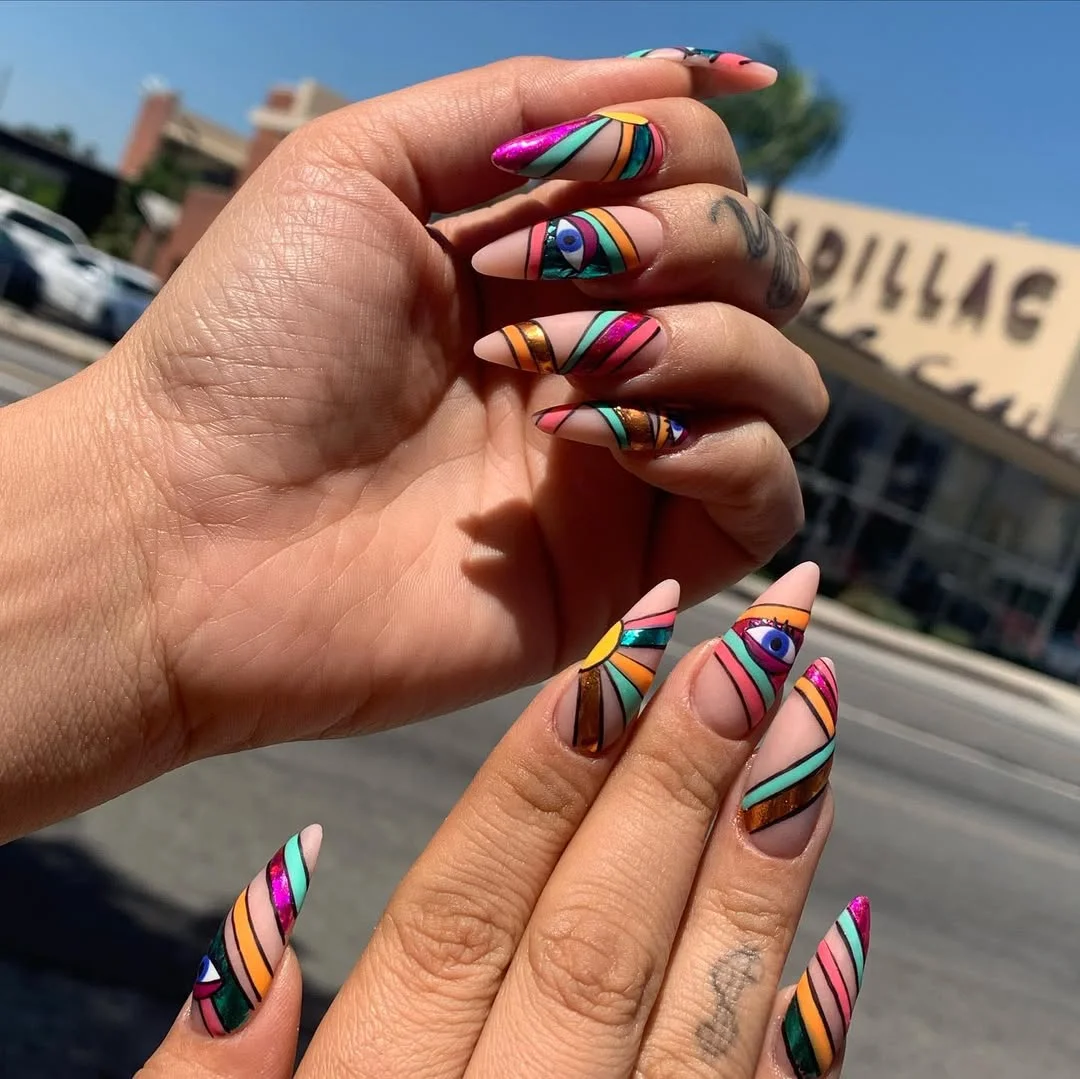 funky summer nails 2026 Bold Graphic Almond Nails With Retro Eye Motifs
