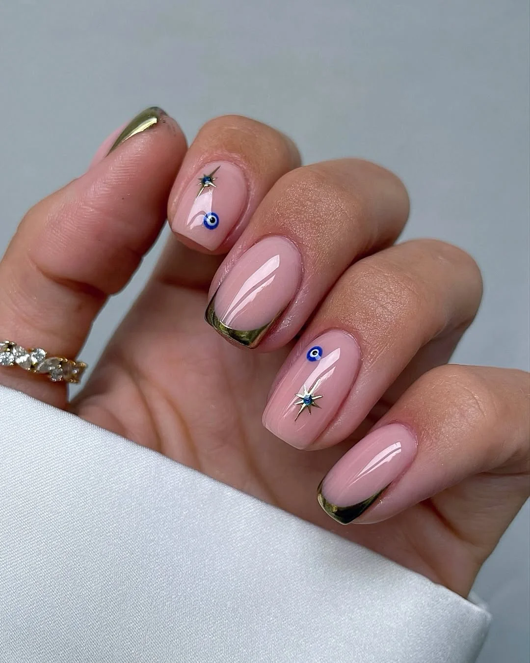 June Nails Ideas 2026 Golden Evil Eye French Tips