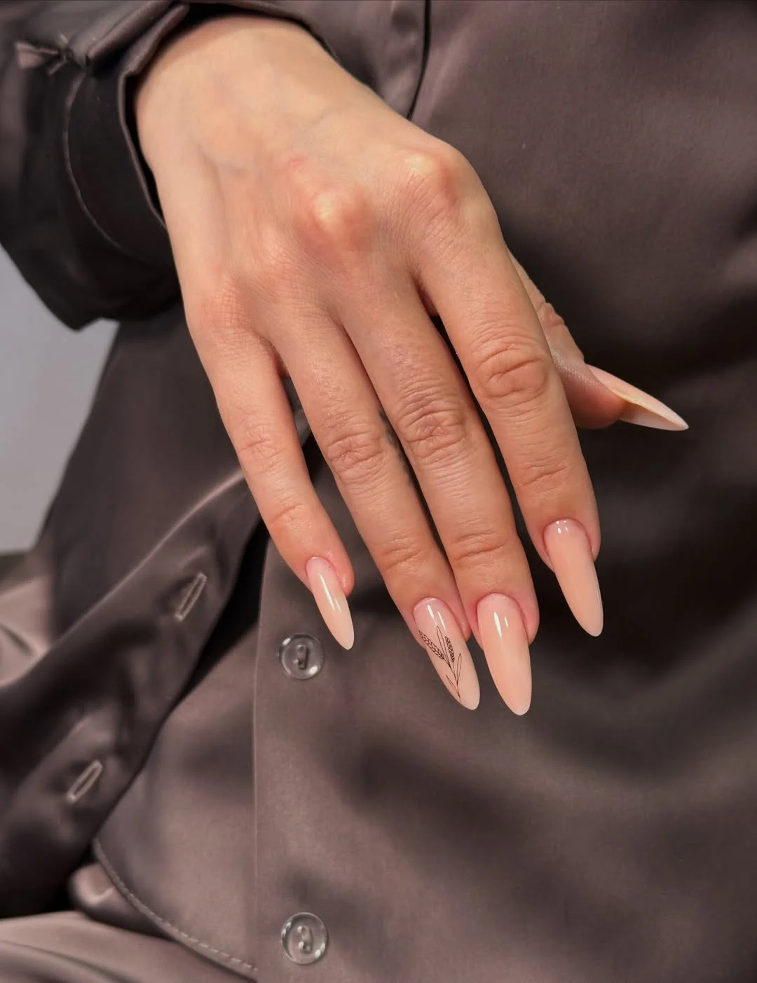light summer nails 2026 Elegant Nude Almond Nails With Delicate Botanical Art