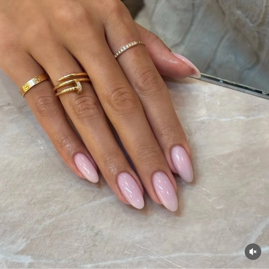 light summer nails 2026 Glossy Milky Pink Almond Nails for Everyday Elegance