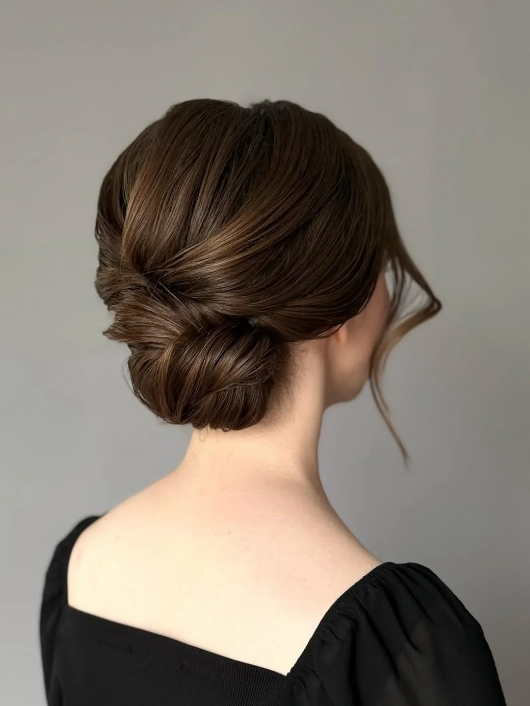 messy summer bun hairstyles 2026 Minimalist Espresso Bun With Sleek Texture