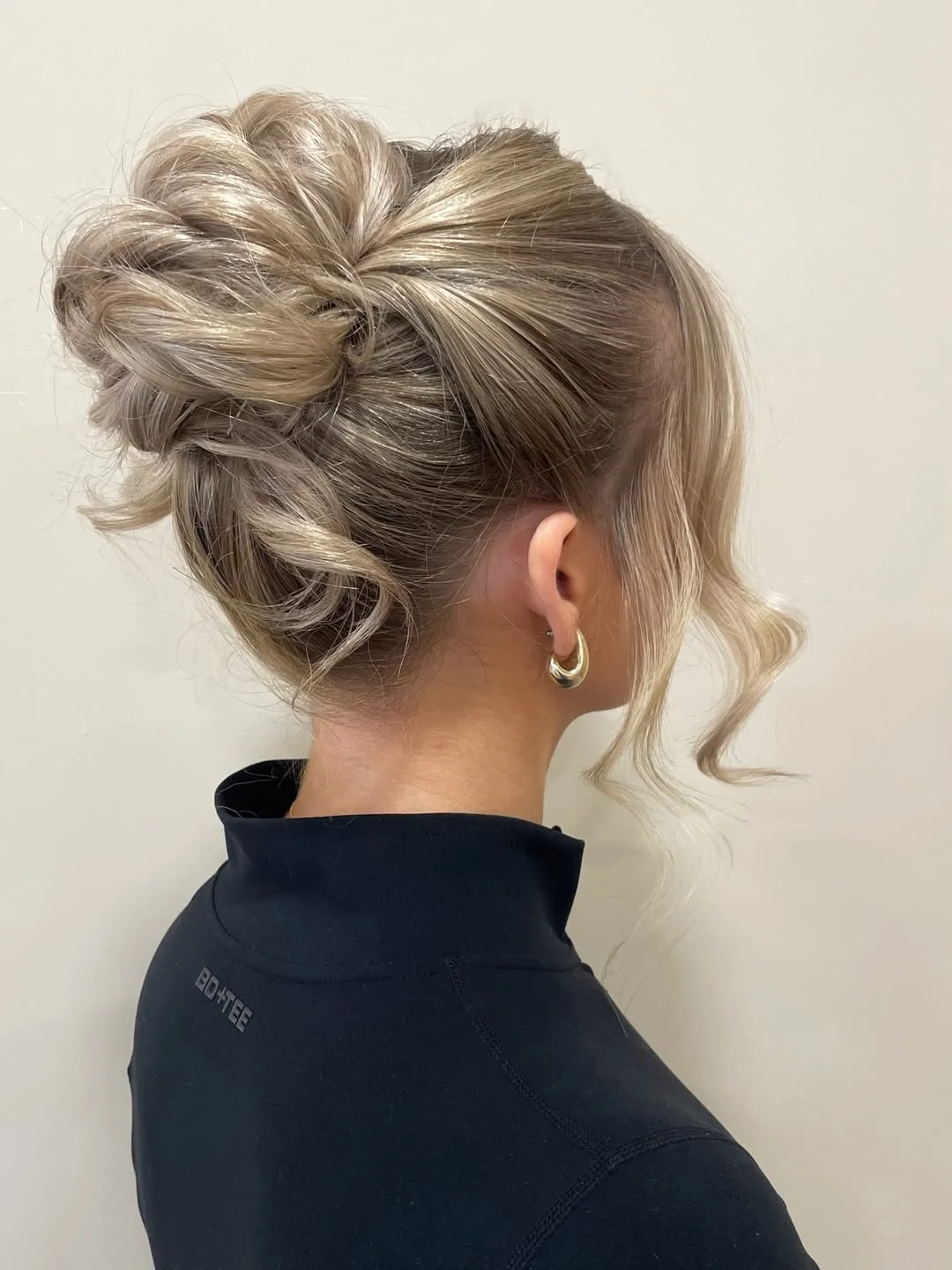 messy summer bun hairstyles 2026 Soft Blonde Bun With Airy Volume
