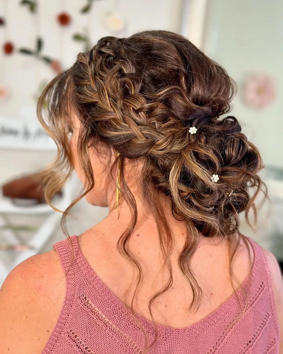 messy summer bun hairstyles 2026 Curly Braided Bun With Romantic Texture