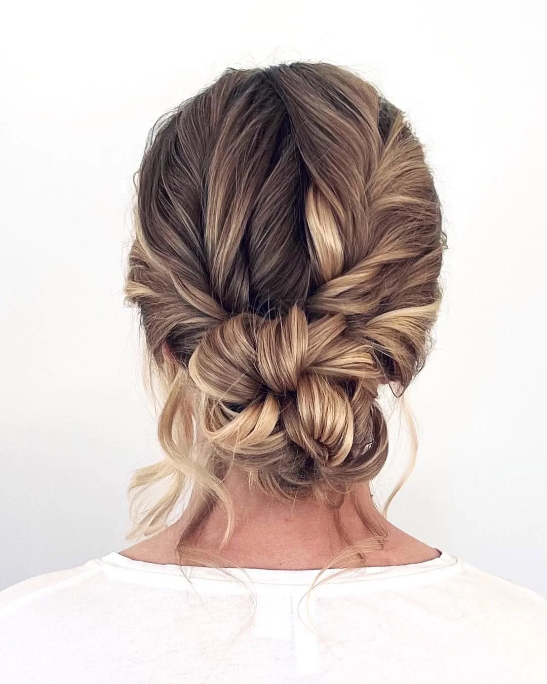 messy summer bun hairstyles 2026 Knotted Bun With Soft Summer Contrast