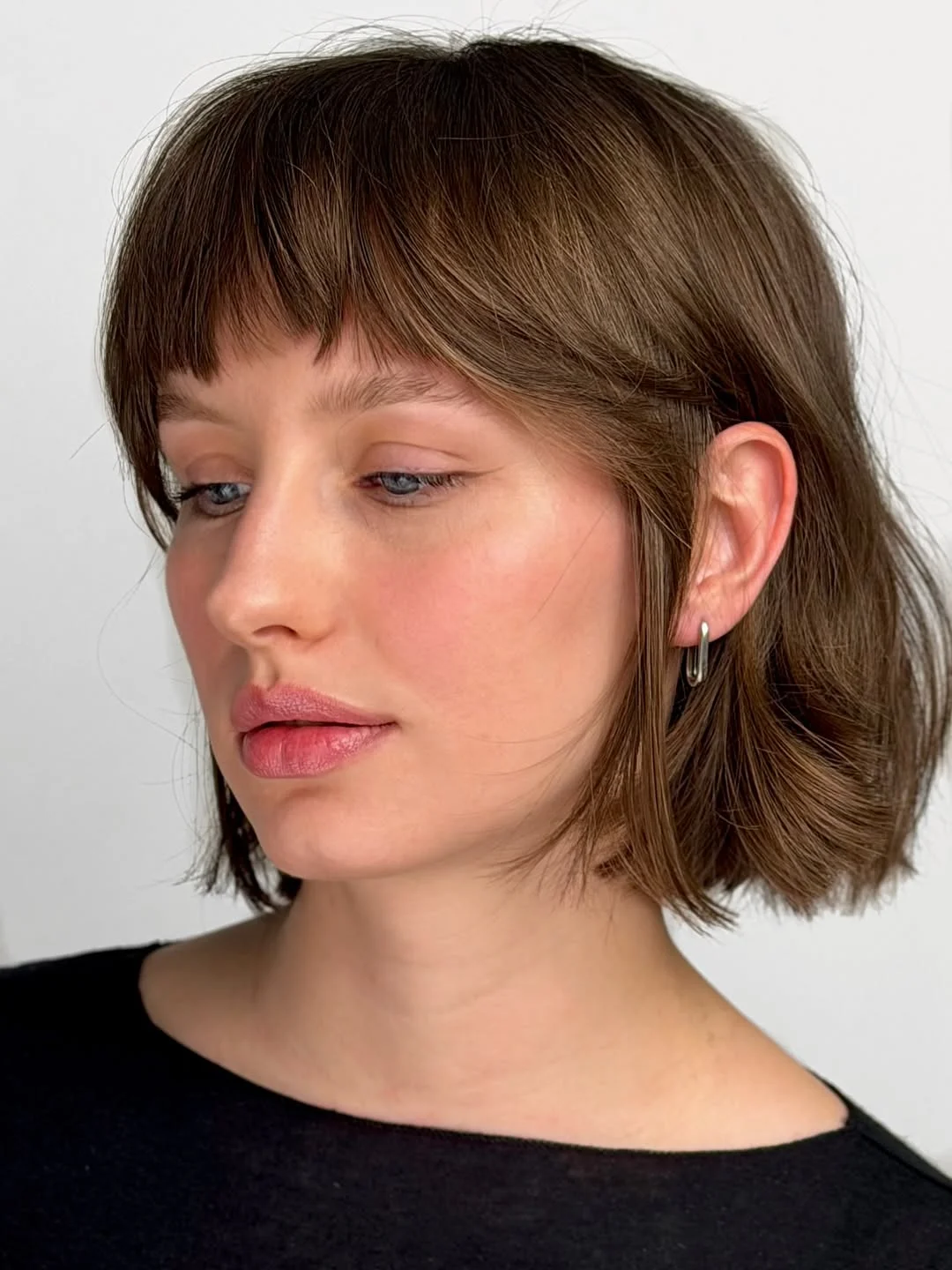 modern summer haircuts for women over 30 2026 Classic French Bob with Clean Fringe