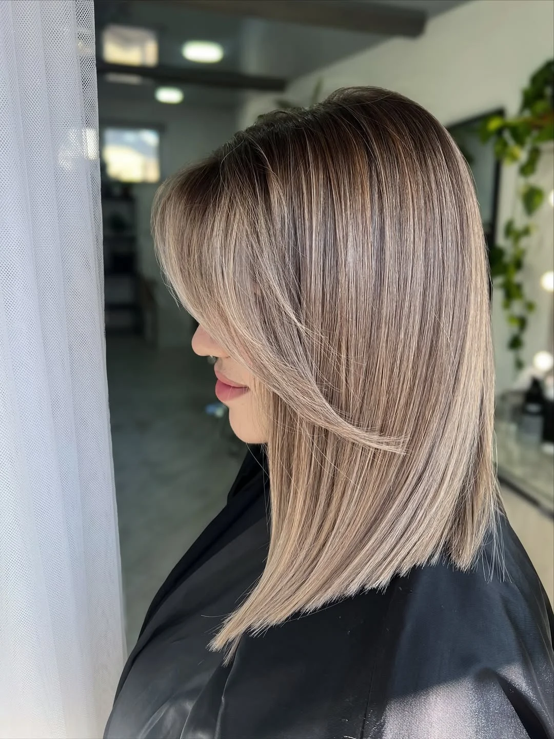 modern summer haircuts for women over 30 2026 Sleek layered blonde with a modern polished finish