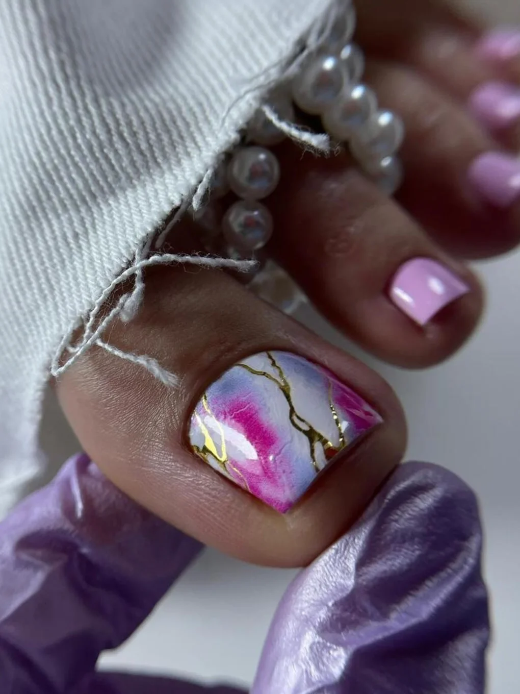 pedicure ideas summer trends 2026 Pink Marble Pedicure With Gold Veins